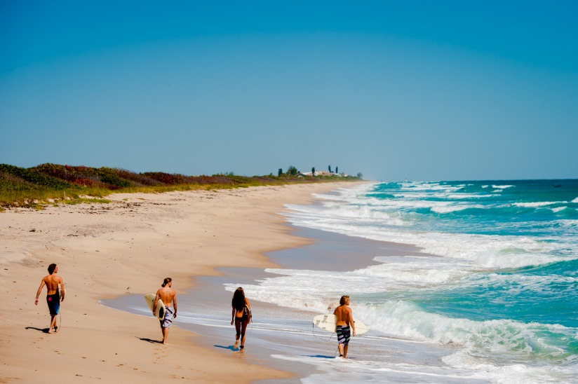 Beach Surfers Walking