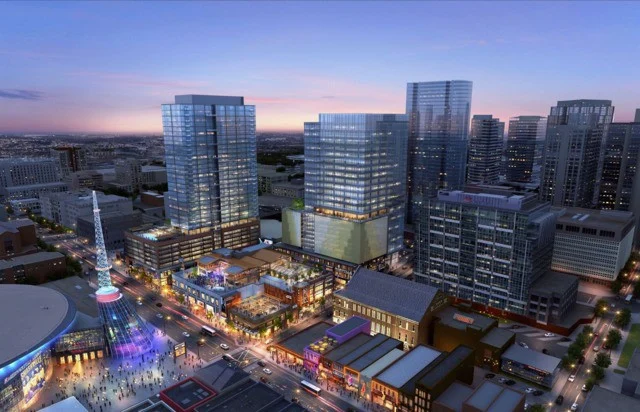 Artist impression van het winkel en woongebouwencomplex Fifth plus Broadway met de Broadway straat op de voorgrond bij schemering in Nashville